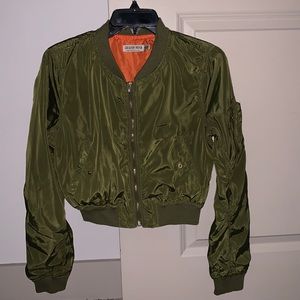 Green crop like jacket with orange inside